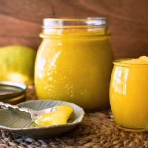 Lemon Curd in jar and on spoon.
