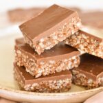 squares of mars bar slice stacked on plate