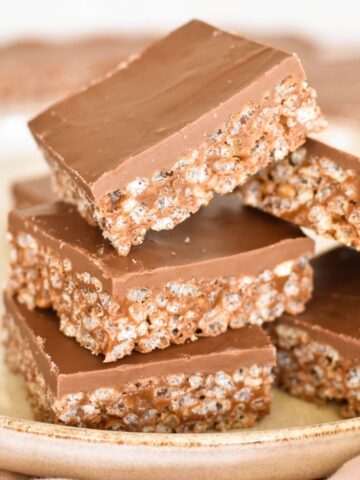 squares of mars bar slice stacked on plate