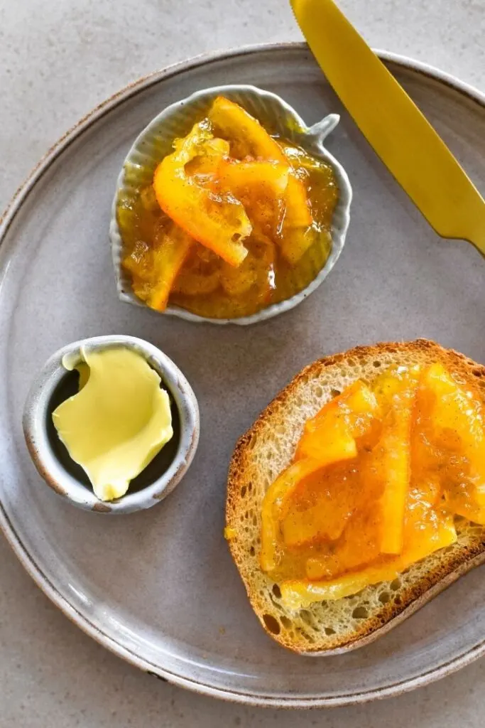 orange marmalade and toast on plate