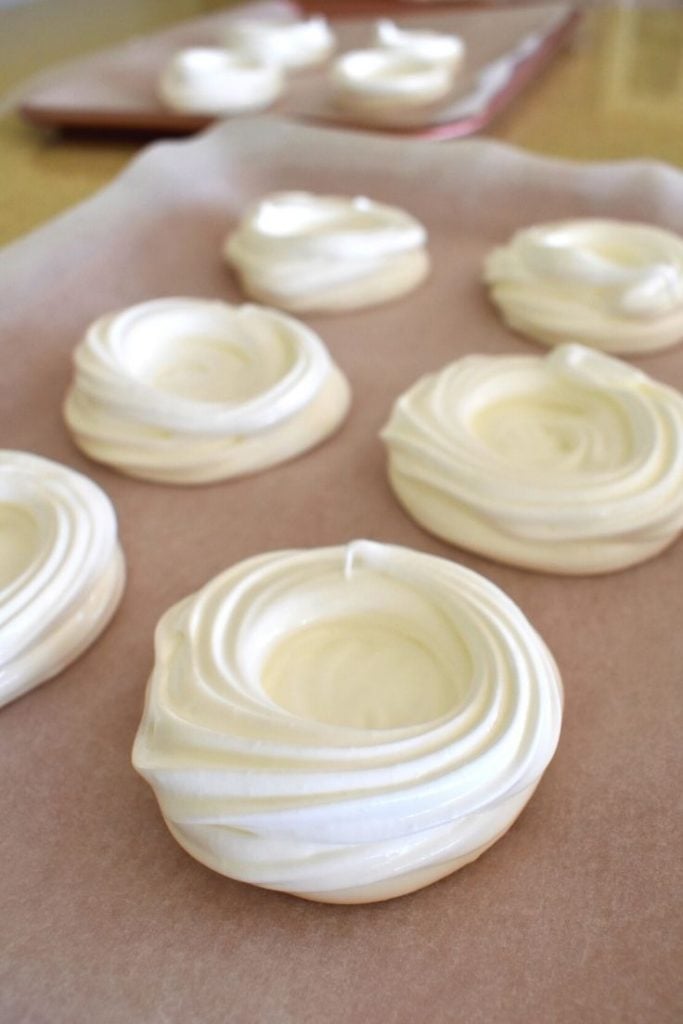 pavlova shells lined up on tray