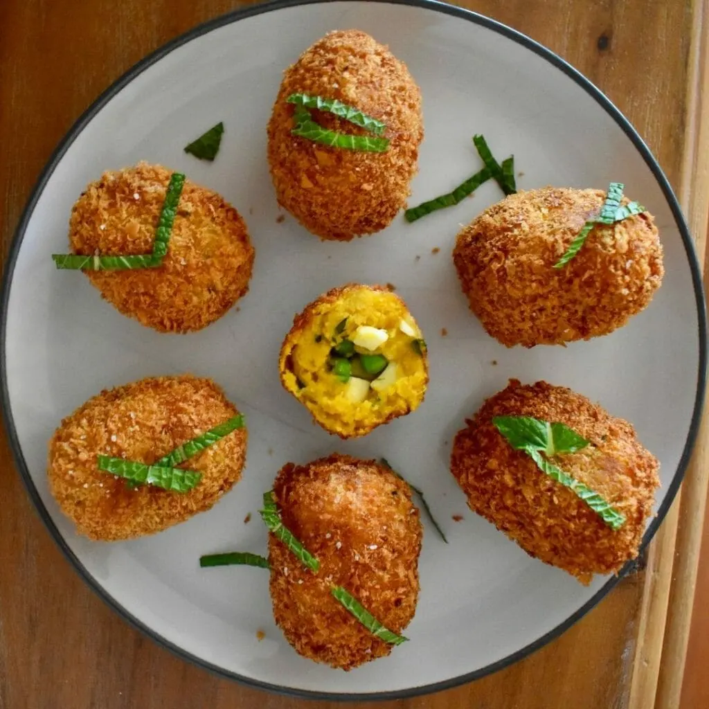 pumpkin croquettes displayed in a round pattern on a plate