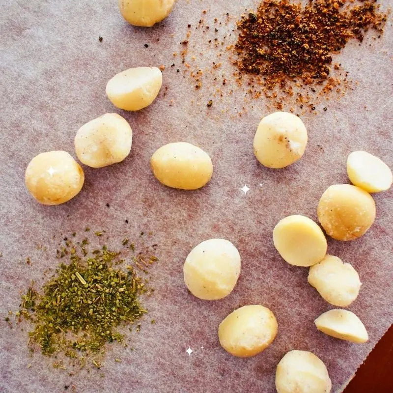 macadamia nuts on parchment paper with spices