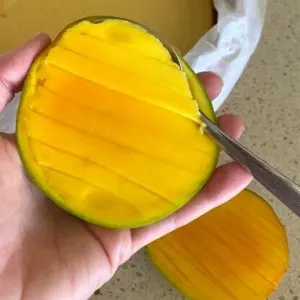 mango being sliced
