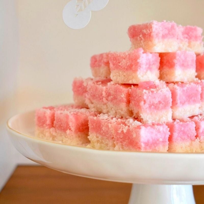 coconut ice coloured white and pink stacked on cake plate