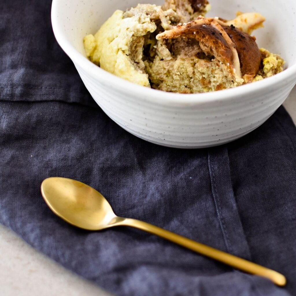 serving of hot cross bun pudding in bowl