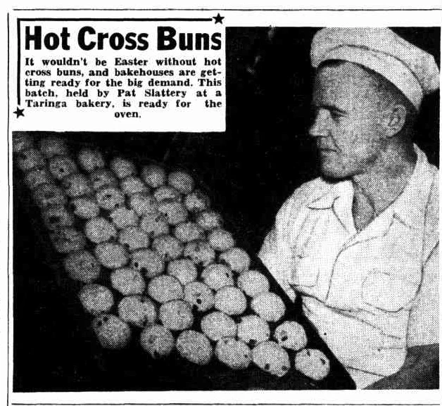 baker with tray of hot cross buns