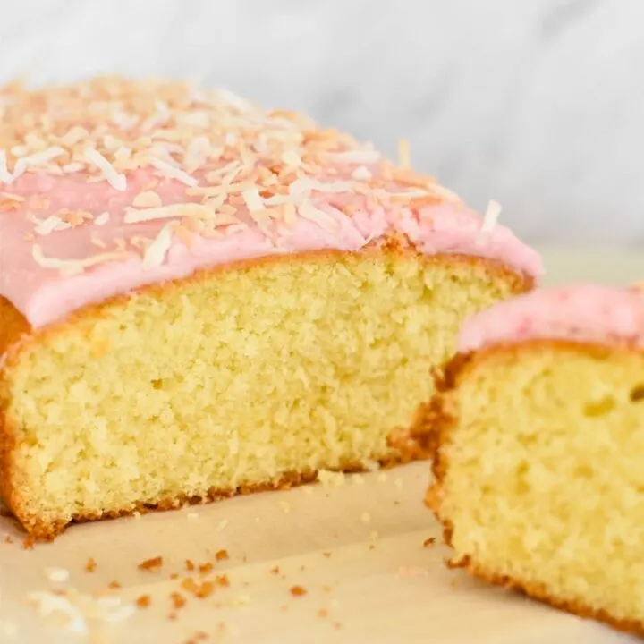 coconut cake with pink icing and lightly toasted coconut
