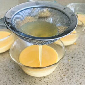 pouring custard from creme caramel