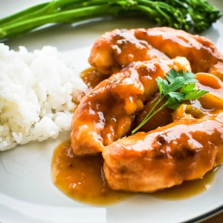 apricot chicken on plate with rice and veges