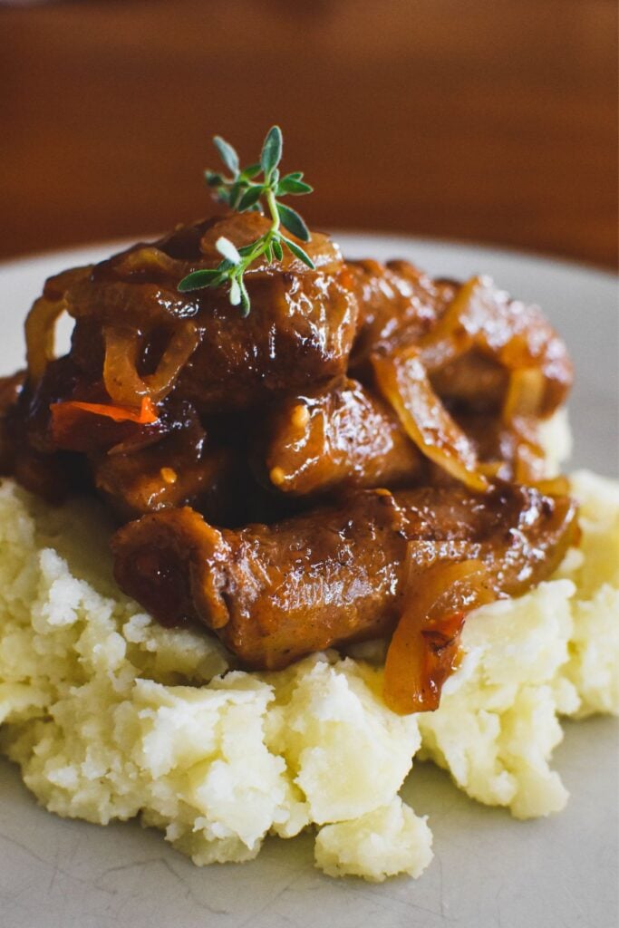 devilled sausages served with mash potato.