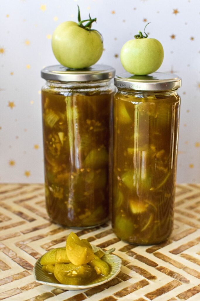 two jars of green tomatoes pickled.