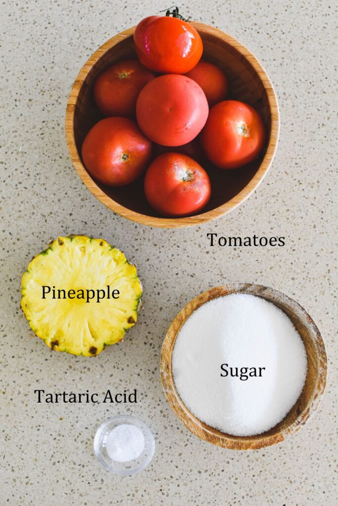 Ingredients for tomato jam on the table.