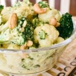 broccoli and cauliflower salad in glass bowl.
