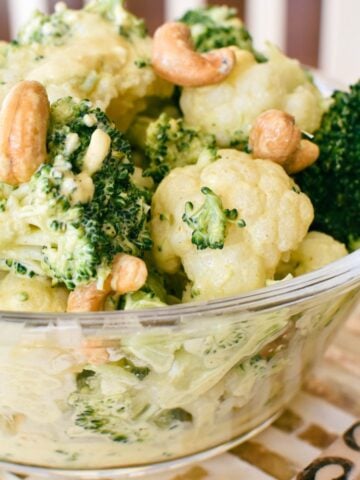 broccoli and cauliflower salad in glass bowl.