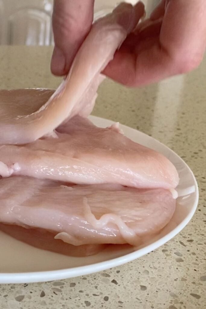 cutting chicken cutlets
