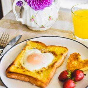 toad in a hole (egg cooked in hole in bread) on a plate.