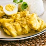 curried eggs on plate with rice.