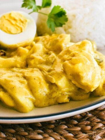 curried eggs on plate with rice.
