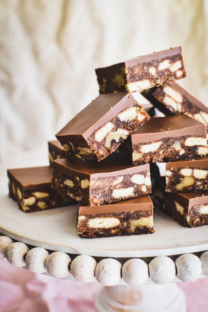 hedgehog slice squares piled up on cake stand.