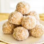 pineapple balls stacked on plate.