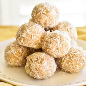 pineapple balls stacked on plate.