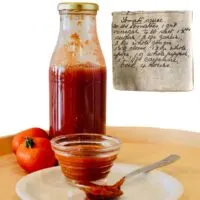 tomato sauce and handwritten recipe for tomato sauce.