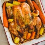 roasted butterfly chicken in baking pan.