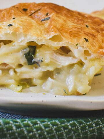 chicken and leek pie on plate showing inside of pie.