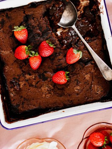 chocolate self saucing pudding served with strawberries and cream.