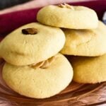 Lebanese butter cookies stacked on plate.