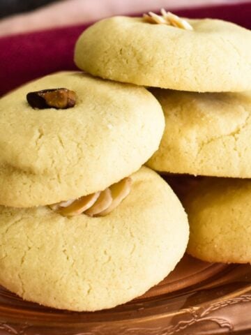 Lebanese Butter Cookies stacked on plate.