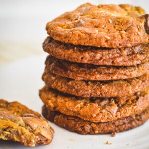 muesli cookies stacked on plate.