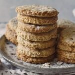 oatmeal biscuits stacked up on plate.