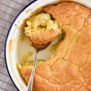 apple sponge in pie dish with spoon.