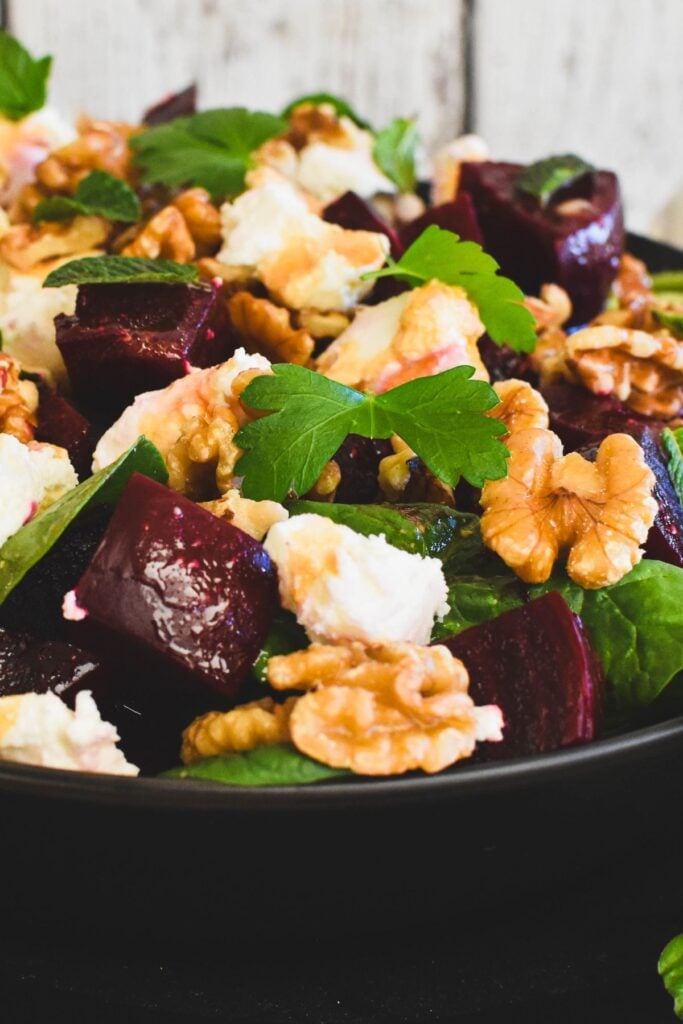 beetroot salad in dark coloured bowl.