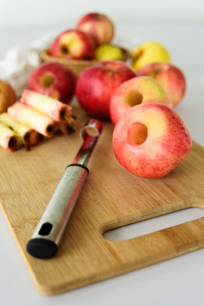 coring apples using an apple corer tool.