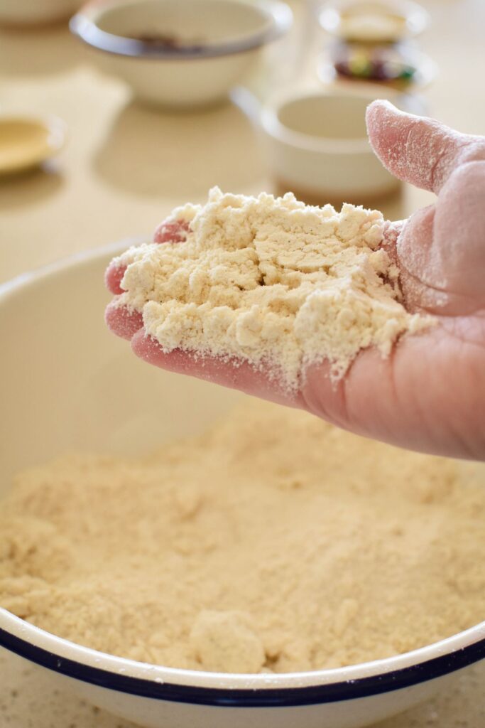 rubbing butter into flour for rock cakes.