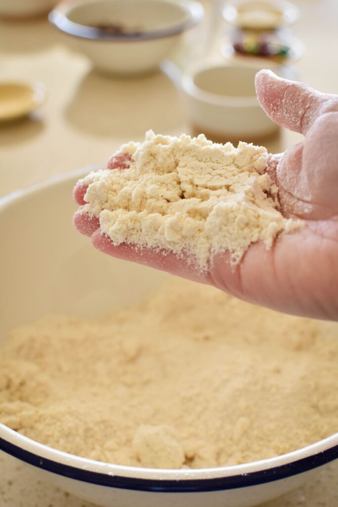 rubbing butter into flour for rock cakes.