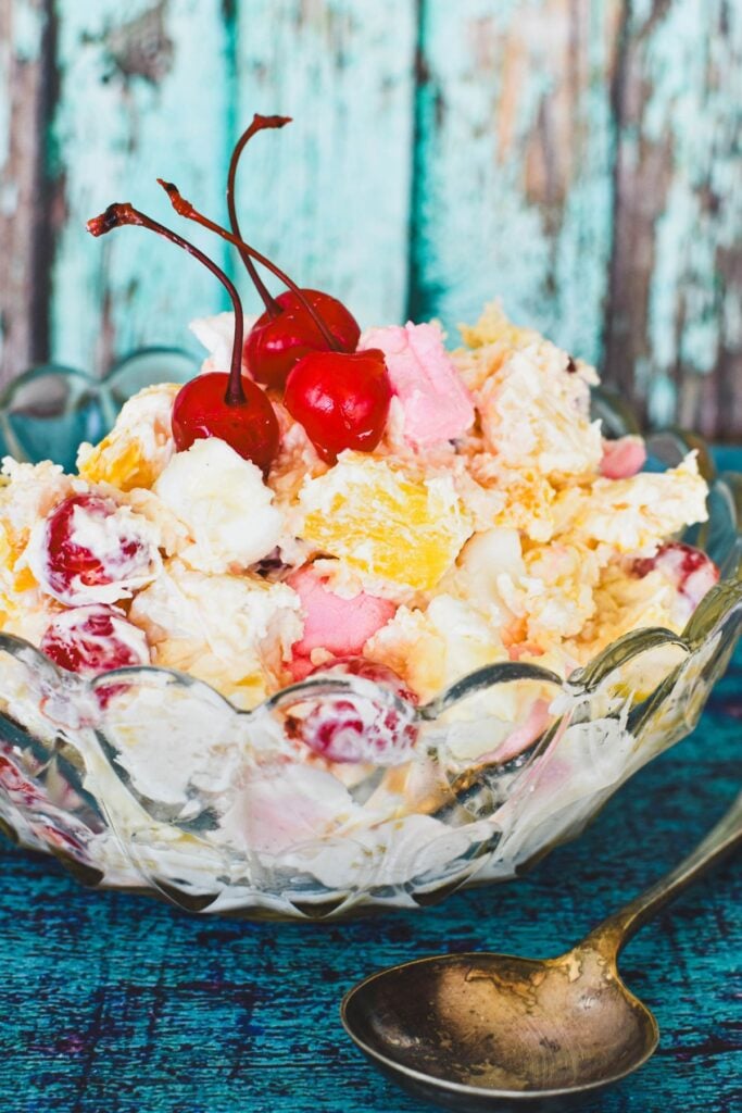 ambrosia salad with cherries on top. 