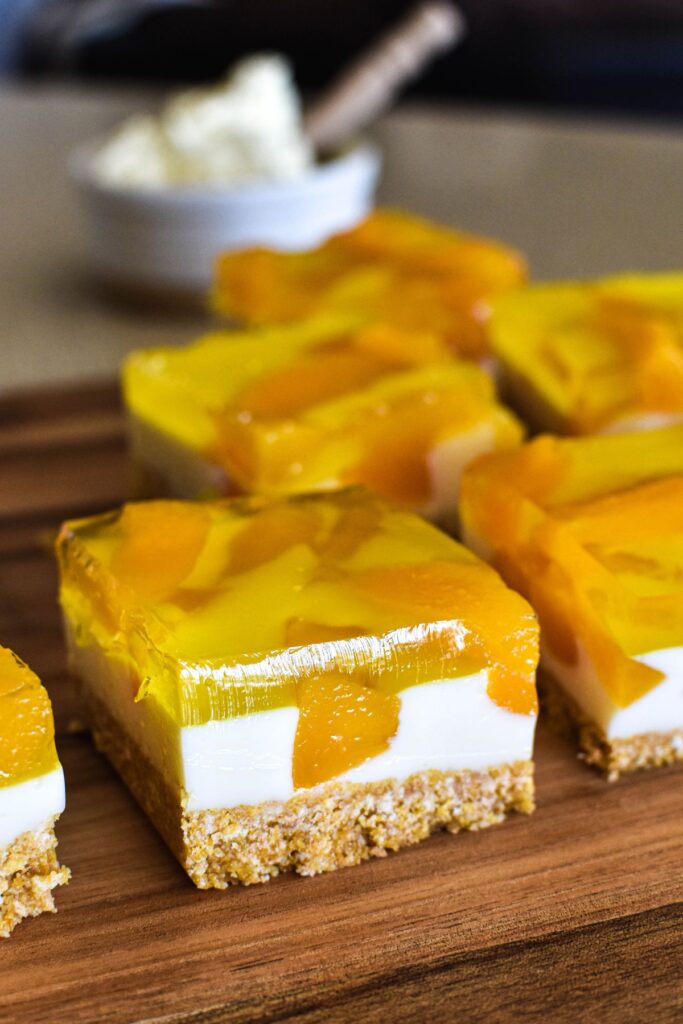 peach slice on wooden board.