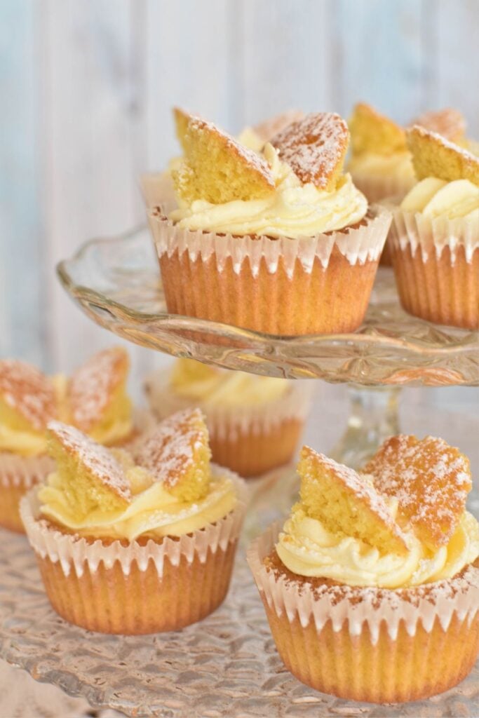 butterfly cakes on two tiered cake stand.