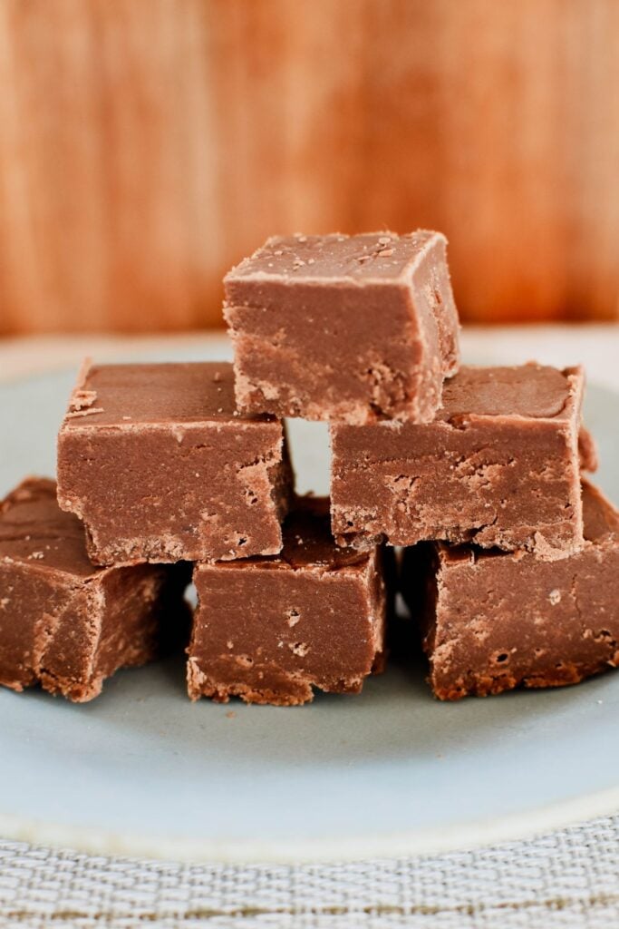 chocolate fudge squares on plate.