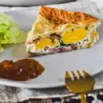 egg and bacon pie on plate.