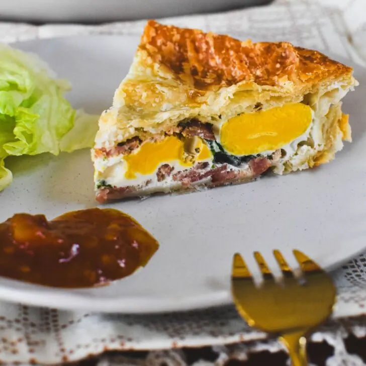egg and bacon pie on plate.