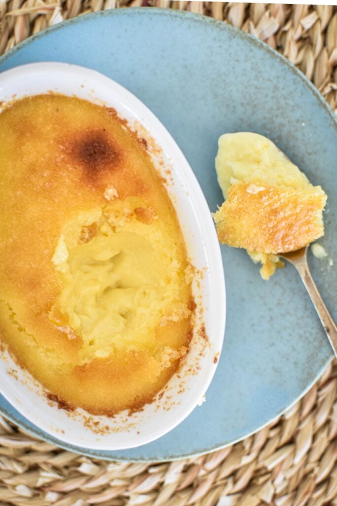 coconut custard on plate with spoon.