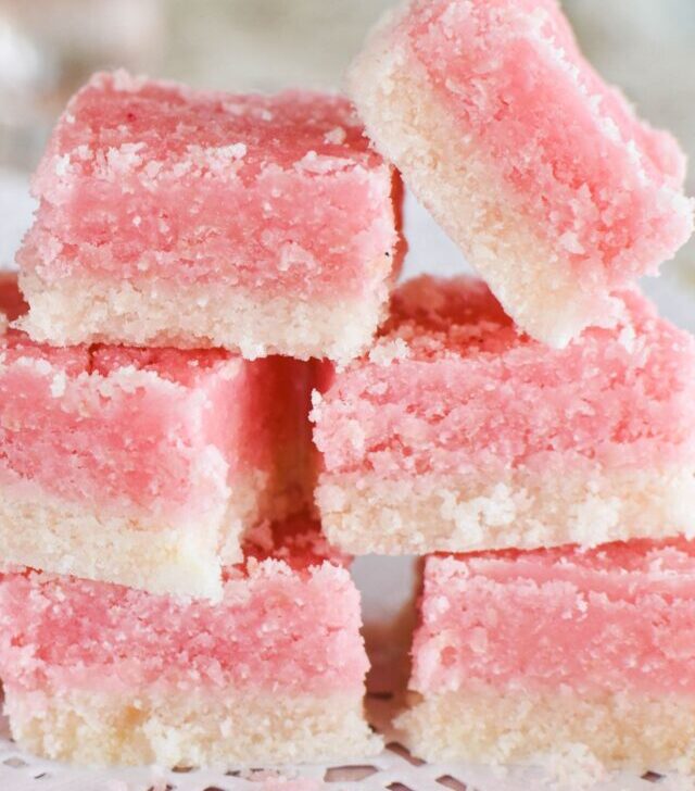 coconut ice stacked on plate.