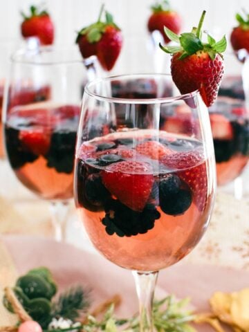 berries in moscato jelly served in wine glasses.