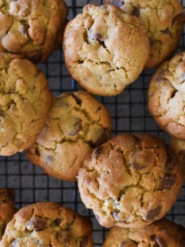 Toll house cookies on cooling tray.