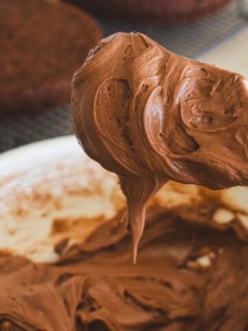 spatula coated in chocolate cake cream cheese icing.